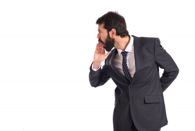 Businessman shouting over isolated white background