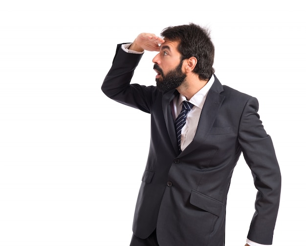 Businessman showing something over white background