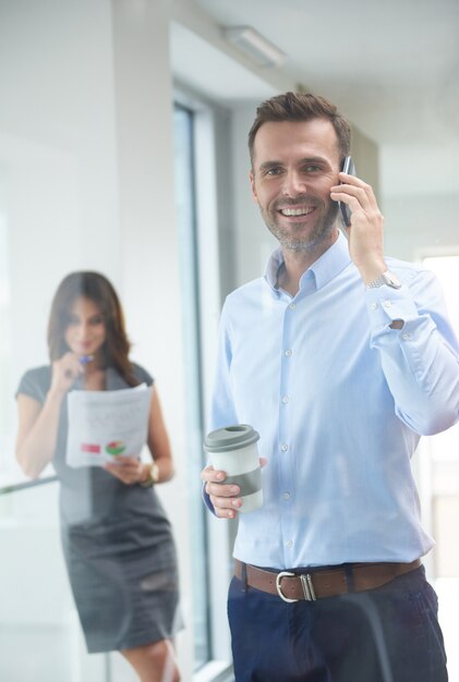 Businessman talking on the phone at work