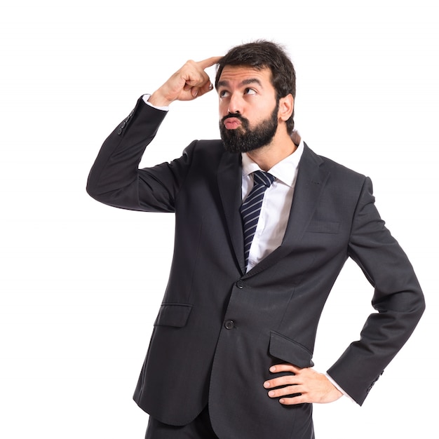 Businessman thinking over isolated white background