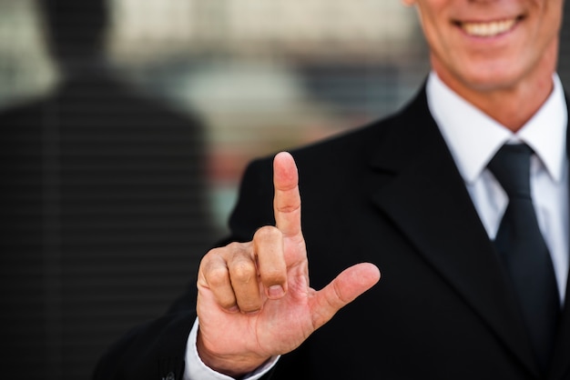 Free Photo businessman two hand gesture