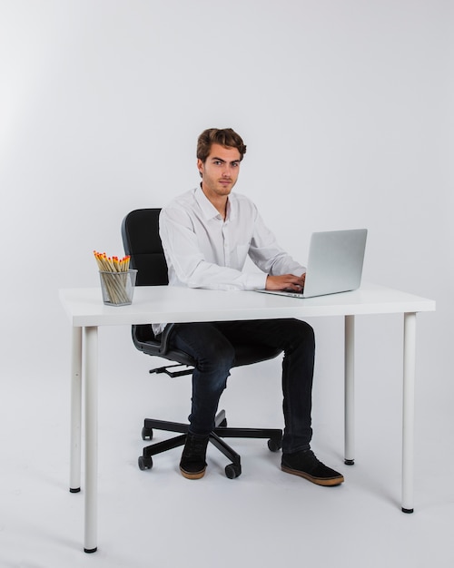 Businessman typing and posing