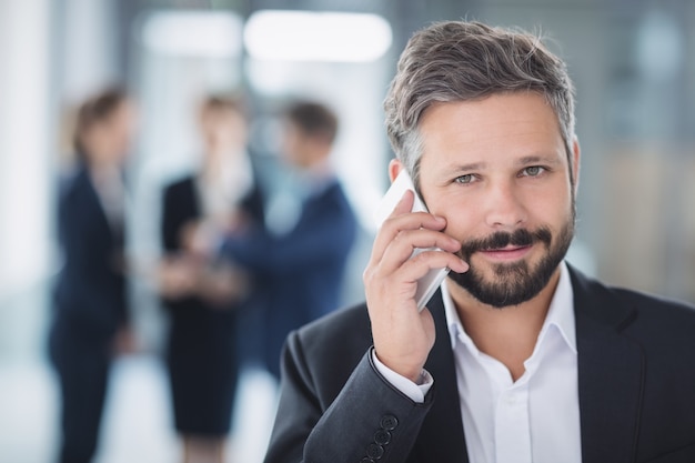 Businessman using mobile phone