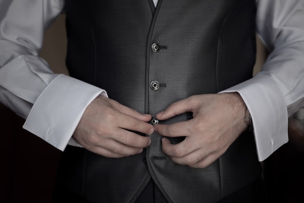 Businessman wearing a jacket before going to work