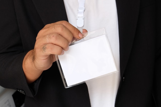 Free photo businessman with business concept holding white card