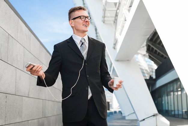 Businessman with earphones