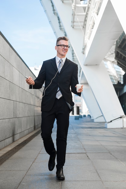 Businessman with earphones