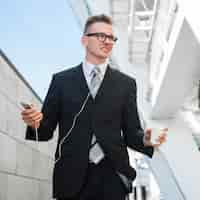 Free photo businessman with earphones