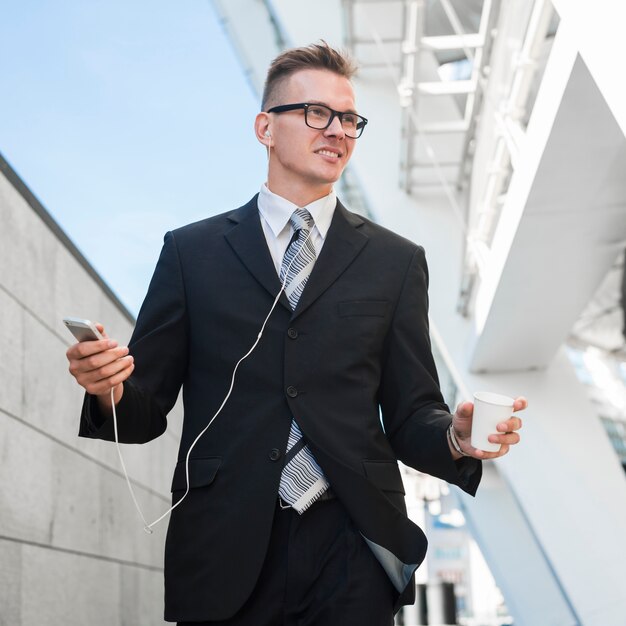 Businessman with earphones