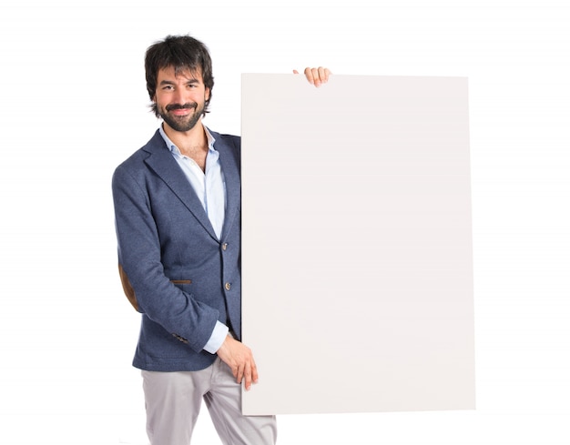 Free photo businessman with empty placard over idolated white background