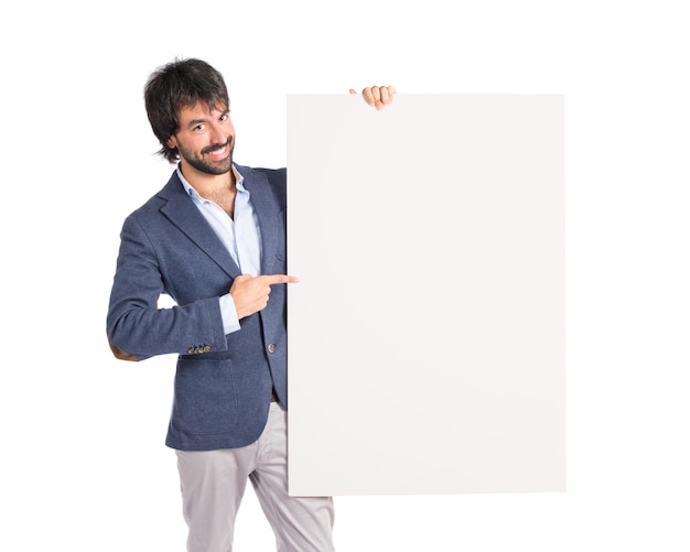 Free photo businessman with empty placard over idolated white background