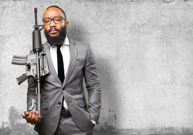 Businessman with machine gun