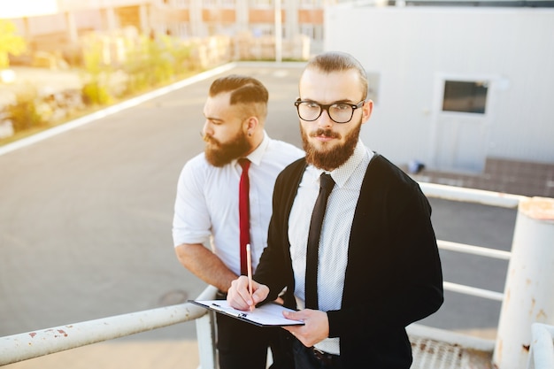 Businessman with pen and clipboard