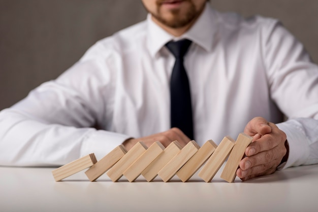 Businessman with tie and dominoes