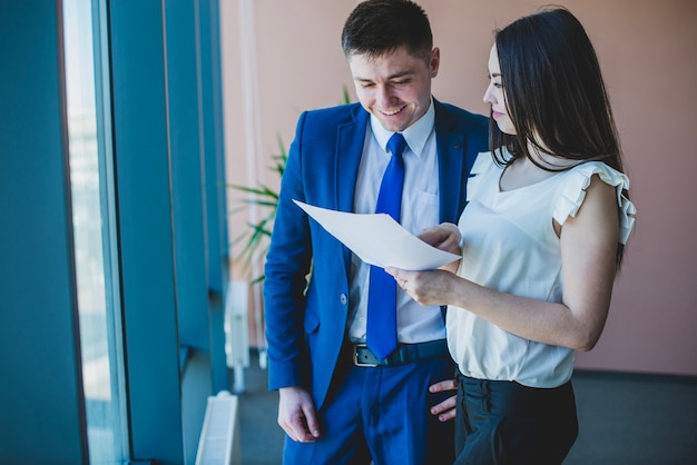 Businessman and woman reading a document