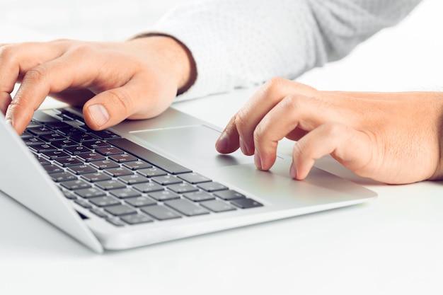 Businessman working on laptop. On the table