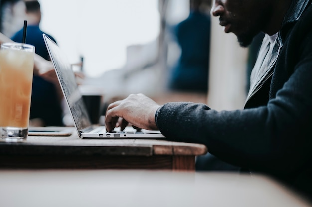 Businessman working remotely from a cafe