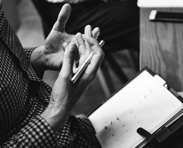 Businessman writing in a calendar