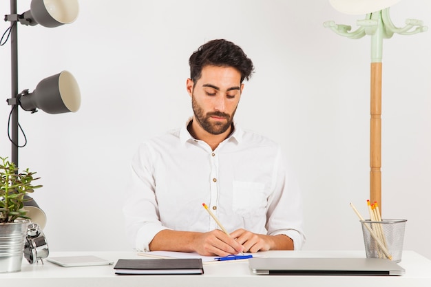 Businessman writing focused