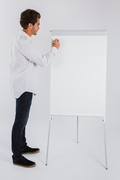 Free photo businessman writing on whiteboard