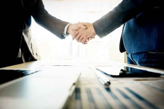 Businessmen shaking hands during a meeting