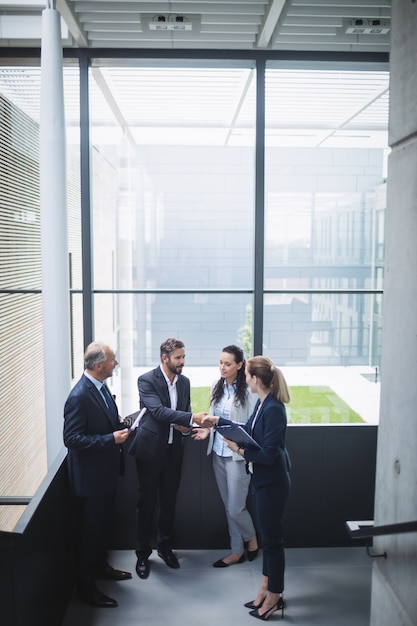 Businesspeople having a discussion in office