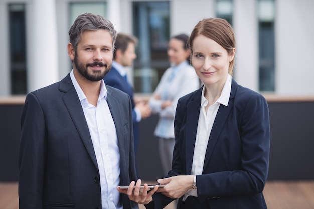 Free Photo businesspeople holding digital tablet