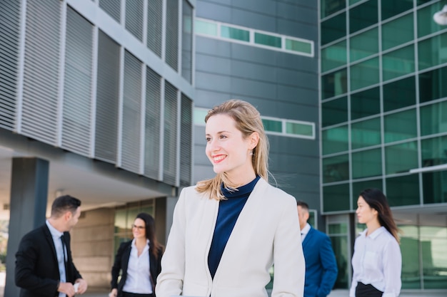 Free photo businesswoman in front of business people