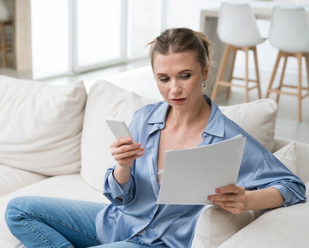 Businesswoman holding documents