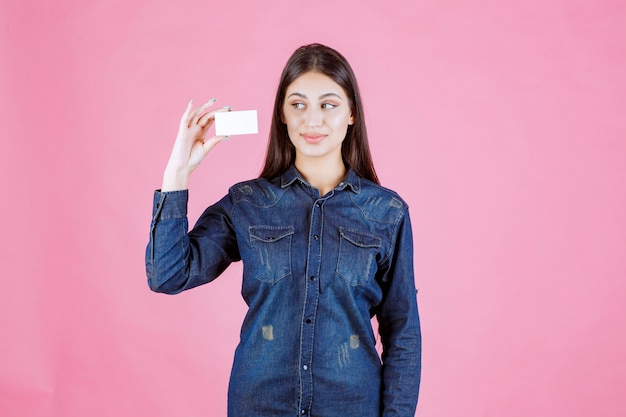 Free Photo businesswoman holding and presenting her new business card