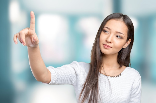 Businesswoman pressing button on visual screen