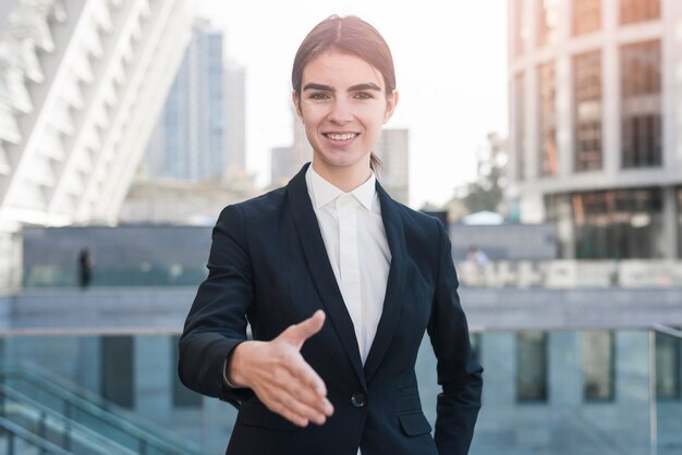 Businesswoman reaching out hand