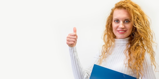 Free Photo businesswoman showing thumbs up sign