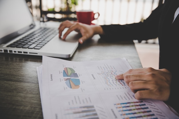 Free Photo businesswoman sitting in desk and work with financial documents company 