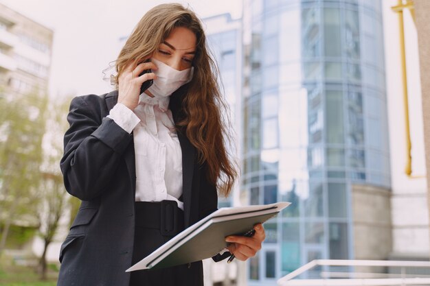 Businesswoman standing outdoors in city office building 