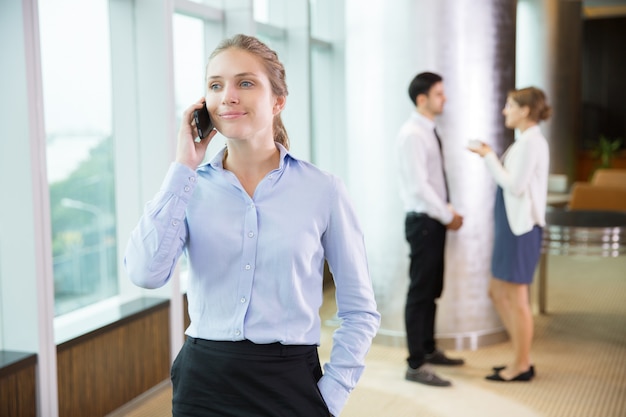 Free photo businesswoman talking on phone in office 5