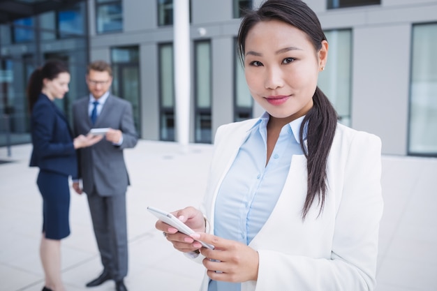 Businesswoman using mobile phone