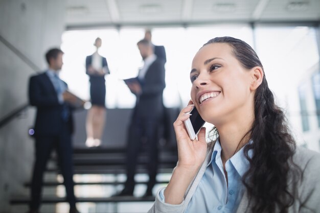 Businesswoman using mobile phone