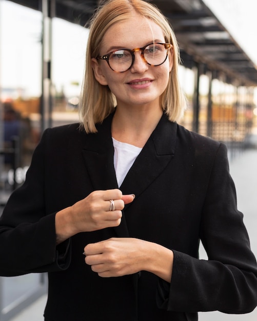 Free Photo businesswoman using sign language outdoors at work