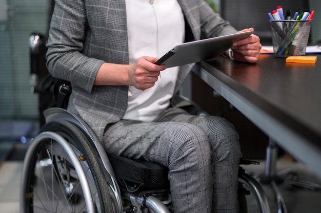 Businesswoman in wheelchair medium view