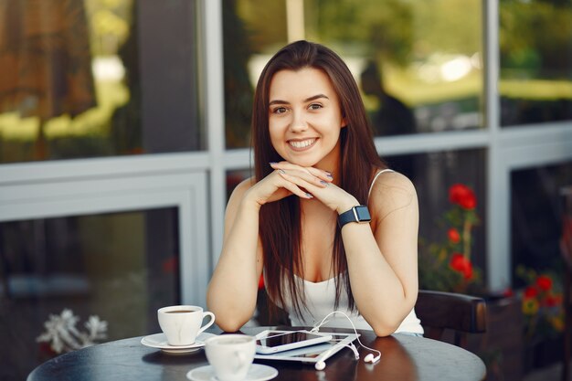 Businesswoman working with a tablet in a cafe