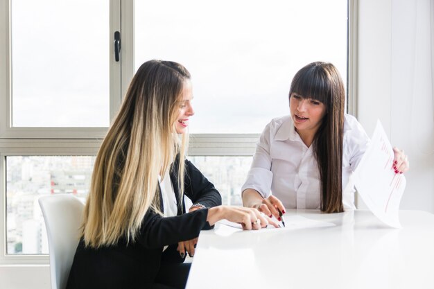 Businesswomen discussing business plan at workplace in the office