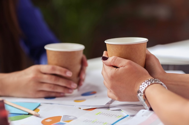 Businesswomen drinking coffee in a break