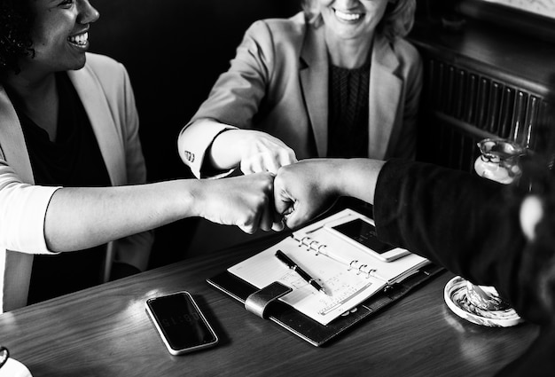 Free Photo businesswomen in a fist bump