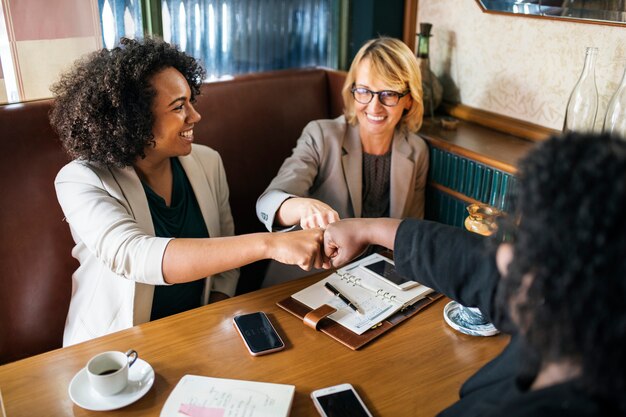 Businesswomen in a fist bump