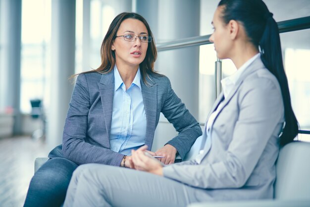 Businesswomen talking about the meeting