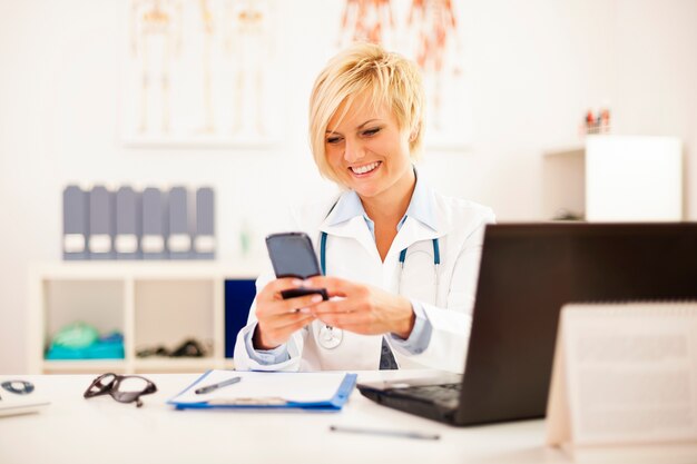 Busy doctor at her office