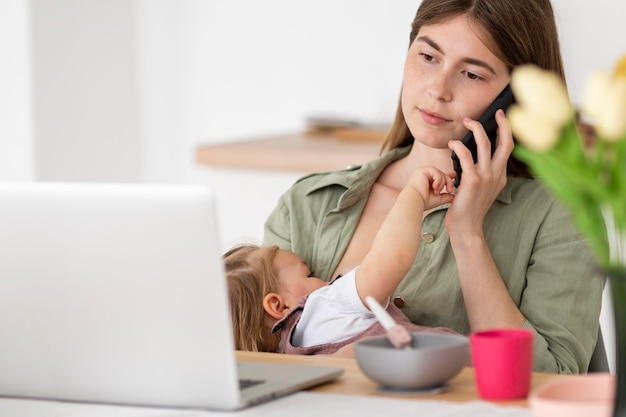 Busy mother with little kid