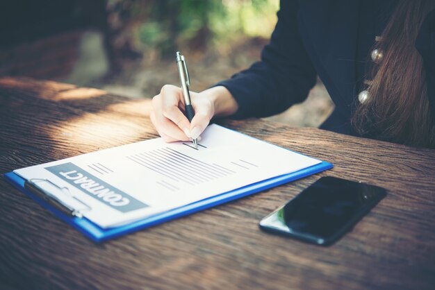 busy professional looking businesspeople writing