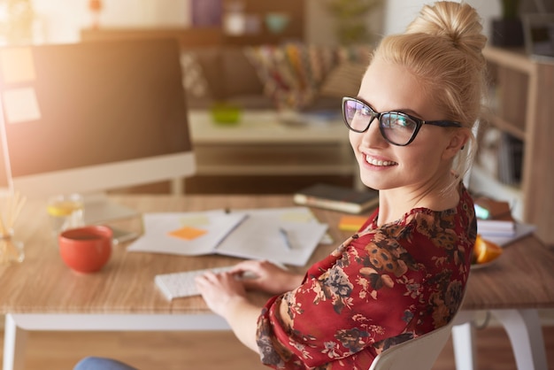 Busy young woman at work